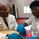 Dr. James Hildreth dissects a frog Friday, March 29, 2019, with seventh-grader Keyshawn Walker at the Haynes Middle Health/Medical Science Design Center in Nashville, Tenn. Hildreth is president and CEO of Nashville’s Meharry Medical College, the nation’s oldest historically black medical school.